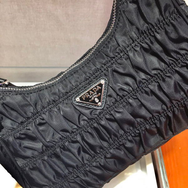 Pra*a nylon and saffiano leather mini bag